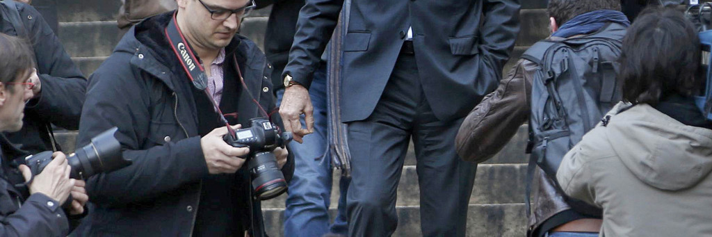 Former French budget minister Jerome Cahuzac, who resigned in 2013 after he admitted to have a Swiss bank account, leaves the courthouse in Paris